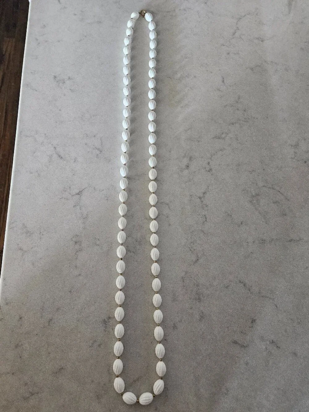 RARE AND VINTAGE WHITE RIBBED OVAL BEAD 48